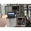 A photo of CTC Signal Conditioner Configuration Software being used in the field with CTC SC Series Signal Conditioners mounted in 3 SCE310 Series Enclosures.